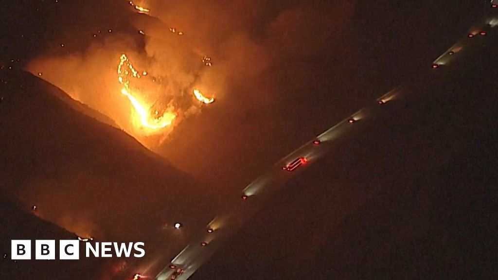 Watch: California wildfires rage near passing vehicles