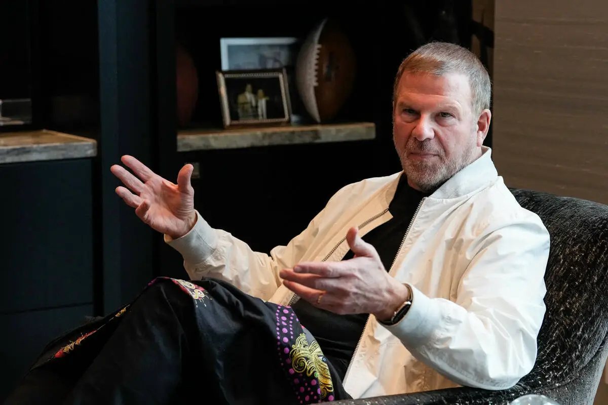 Who is Tilman Fertitta, the billionaire acquiring Caesars Entertainment?