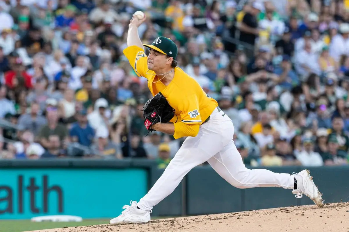 Ginn loses no-hitter in 7th inning as A’s rout Nationals to stop 10-game skid