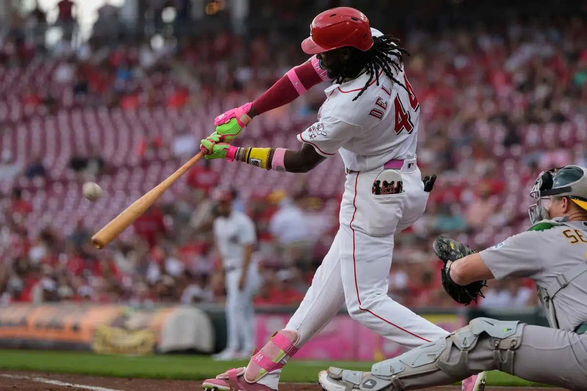 Reds homer 4 times, beat A’s 6-5 to complete sweep