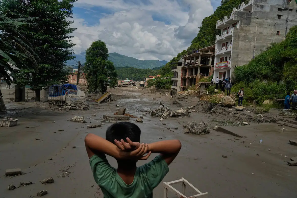 At least 160 killed and hundreds missing after flash floods in Nepal and China