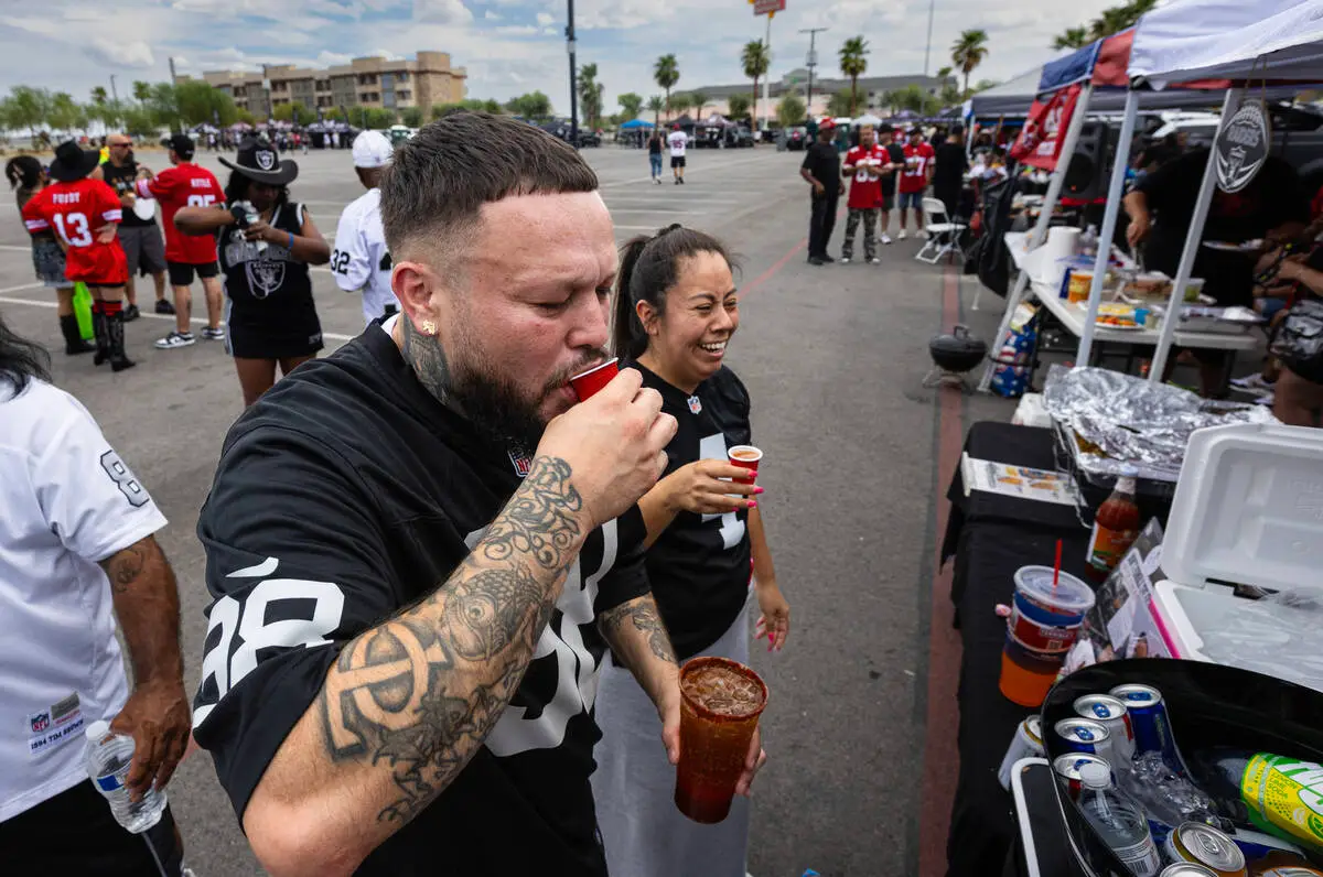 Sizzling weather doesn’t keep Raider faithful from tailgating outside Allegiant Stadium