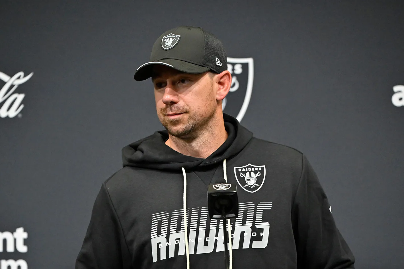 Raiders coach Klint Kubiak speaks to the media