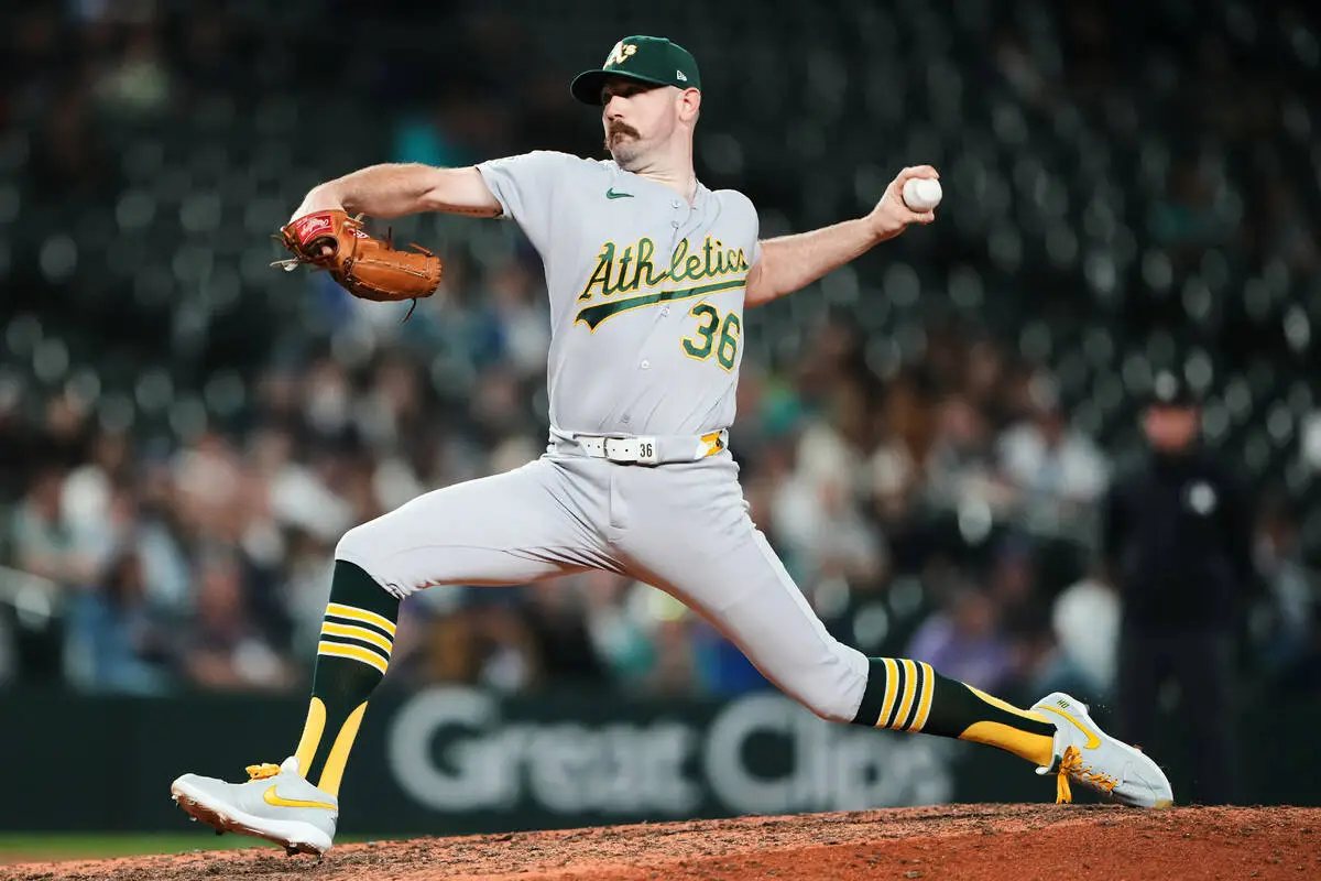 A’s pitchers combine for 18 strikeouts in 7-4 win over Mariners