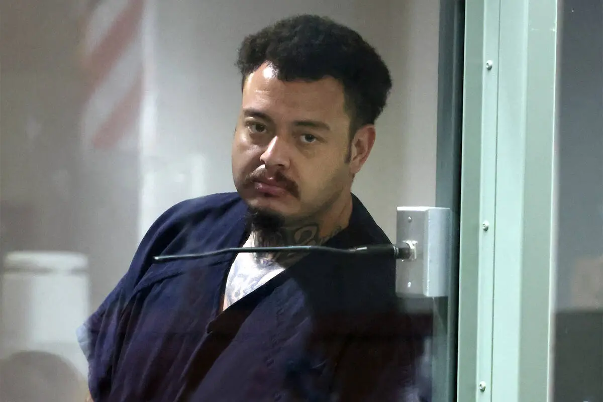 Police: Convicted killer shot neighbor as victim’s sons waited for their dad