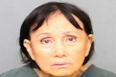 Woman allegedly caught on video running over puppy is taken into custody