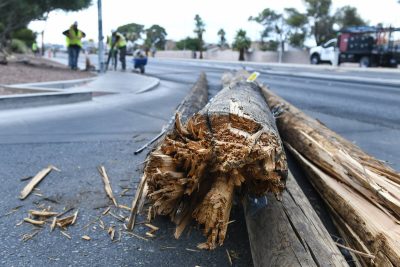 ‘Domino-like fashion’: Woman trapped in car after utility poles fell on car, lawsuit alleges